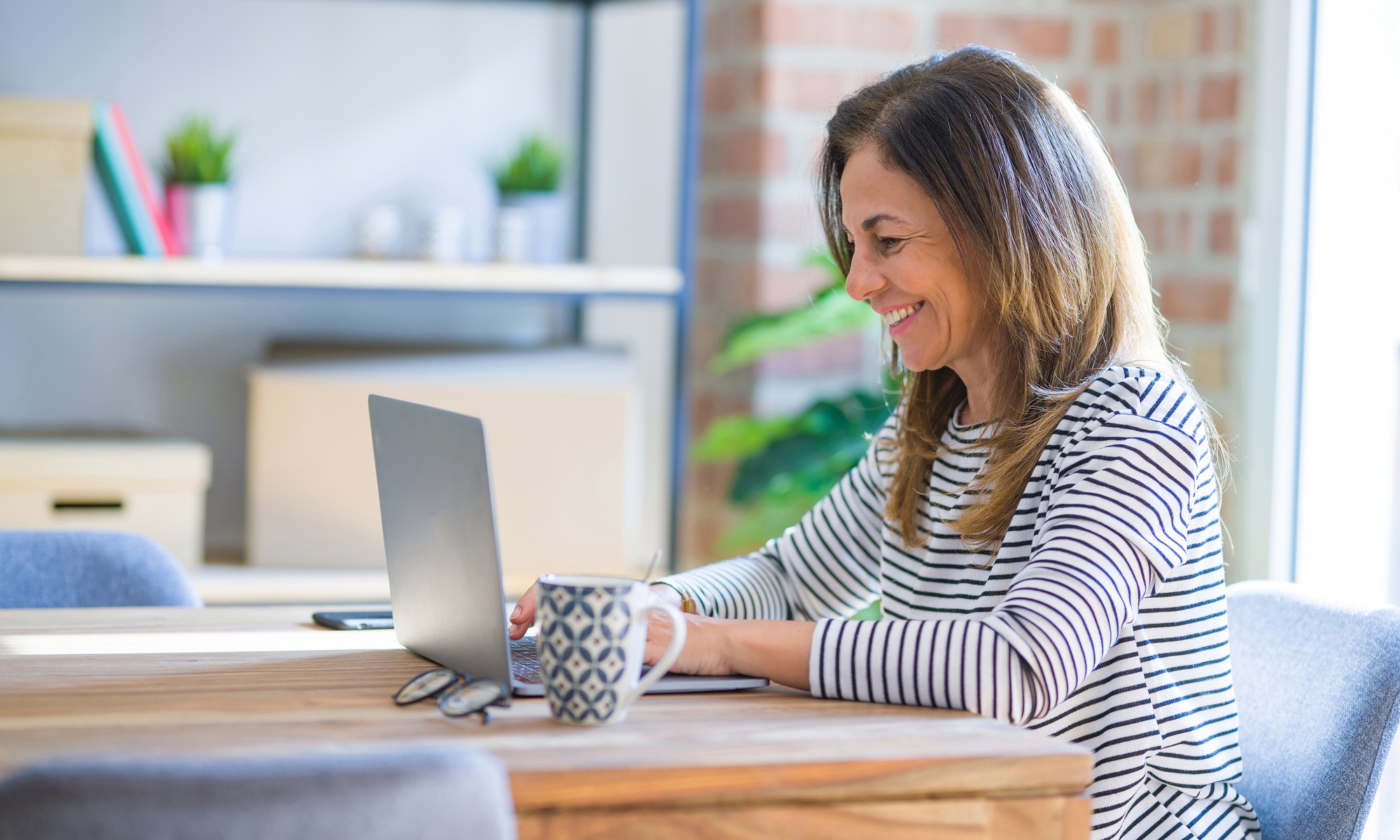 Busy professional lady studies English online in office